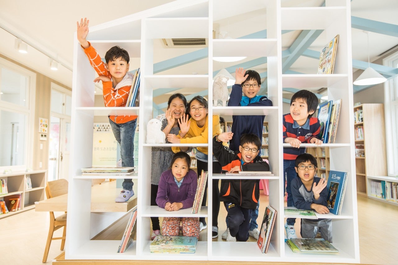 Nu Hope Library 3 Korean children in a Nu Hope Library.