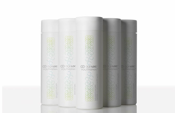 pt3 6S Quality Process pt3-1 Five Nu Skin AgeLoc Youthspan bottles on display.