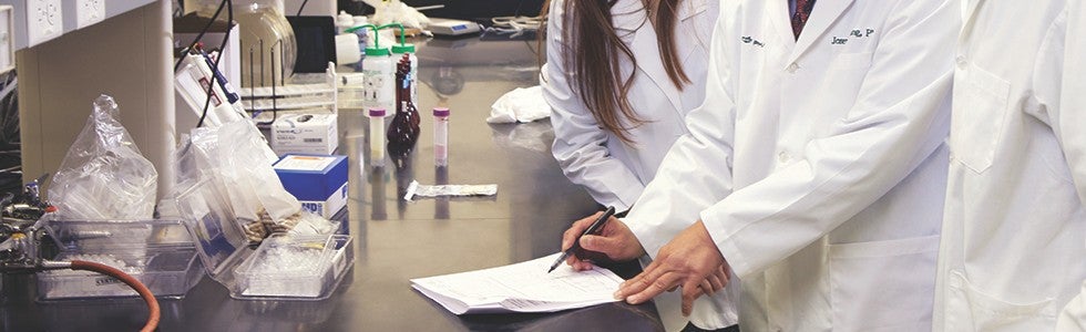 science-02 Nu Skin scientists taking notes as they conduct research.
